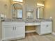 Bright ensuite bathroom featuring dual sinks, granite countertops, modern lighting and fixtures at 1586 N Himosa Dr, Casa Grande, AZ 85122