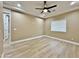 Spacious bedroom featuring recessed lighting, fan and wood tile floors with a window providing natural light at 1586 N Himosa Dr, Casa Grande, AZ 85122