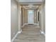 Inviting entryway with wood-look tile flooring and a bright white front door at 1586 N Himosa Dr, Casa Grande, AZ 85122