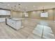 Open kitchen and living area with a large island and modern lighting fixtures at 1586 N Himosa Dr, Casa Grande, AZ 85122