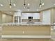 Well-lit kitchen featuring a large island, granite countertops, stainless steel appliances, and modern pendant lighting at 1586 N Himosa Dr, Casa Grande, AZ 85122