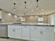 Close-up of a kitchen island featuring granite countertops and stylish pendant lighting at 1586 N Himosa Dr, Casa Grande, AZ 85122