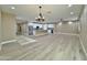 Open-concept living area with modern chandelier and view into the stylish kitchen at 1586 N Himosa Dr, Casa Grande, AZ 85122