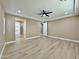 Primary bedroom featuring a tray ceiling, ceiling fan, and ensuite bathroom with a walk-in closet at 1586 N Himosa Dr, Casa Grande, AZ 85122