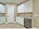 Pantry or Butler's Pantry with white cabinets, granite countertop and wine fridge at 1586 N Himosa Dr, Casa Grande, AZ 85122