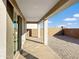 View of the covered patio with concrete floor and brick pavers in the backyard at 1737 W Hopi Dr, Coolidge, AZ 85128