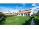 Expansive backyard features a lush lawn and covered patio, ideal for outdoor entertaining at 17414 N 56Th Way, Scottsdale, AZ 85254