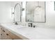 Elegant bathroom with marble countertops, modern sinks, and a stylish glass-enclosed shower at 17414 N 56Th Way, Scottsdale, AZ 85254