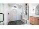 Modern bathroom featuring marble walls, a glass shower with dual shower heads and a built-in bench at 17414 N 56Th Way, Scottsdale, AZ 85254
