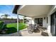 Inviting covered patio with an outdoor dining area, perfect for entertaining and enjoying the serene backyard view at 17414 N 56Th Way, Scottsdale, AZ 85254