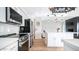 Bright kitchen showcases stainless steel appliances, herringbone floors, and quartz countertops at 17414 N 56Th Way, Scottsdale, AZ 85254