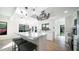 Open-concept kitchen featuring a center island with seating and modern lighting fixtures at 17414 N 56Th Way, Scottsdale, AZ 85254