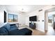 Cozy living room offers a plush sofa, modern lighting, and a view to the outdoors at 17414 N 56Th Way, Scottsdale, AZ 85254