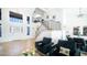 Bright living room features high ceilings, wood floors, and a staircase with iron railings at 17414 N 56Th Way, Scottsdale, AZ 85254