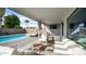 Inviting patio with comfortable seating, an outdoor TV, and a view of the pool area at 17414 N 56Th Way, Scottsdale, AZ 85254