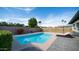 Sparkling pool is surrounded by greenery and patio, offering a serene outdoor retreat at 17414 N 56Th Way, Scottsdale, AZ 85254