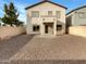 View of the spacious backyard with gravel and a block wall at 17649 W Young St, Surprise, AZ 85388