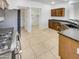 The kitchen features granite countertops, wood cabinets, and stainless steel appliances at 17649 W Young St, Surprise, AZ 85388