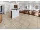 Bright and airy open-concept living space with dining area and a staircase leading to the upper level at 17649 W Young St, Surprise, AZ 85388