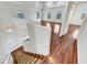Upstairs view showcasing wood floors, staircase, and an open and bright living space with abundant natural light at 17649 W Young St, Surprise, AZ 85388