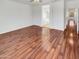 Bright and airy main bedroom features hardwood floors and an ensuite bathroom with a tub and glass shower at 17649 W Young St, Surprise, AZ 85388