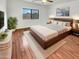 Bed with a wood frame, soft rug and a large window for great light at 17649 W Young St, Surprise, AZ 85388