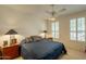 This bedroom features plantation shutters on its window that let in plenty of natural light at 18215 N Shadow Ct, Surprise, AZ 85374