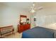 Bedroom featuring a dresser with large mirror, ceiling fan and closet with sliding doors at 18215 N Shadow Ct, Surprise, AZ 85374
