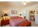 A comfortable bedroom with a large window and access to an en suite bathroom at 18215 N Shadow Ct, Surprise, AZ 85374