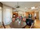Cozy breakfast nook features a round table, bright windows with exterior views, and easy kitchen access at 18215 N Shadow Ct, Surprise, AZ 85374