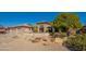 Charming single-story home featuring desert landscaping, tiled roof, and an attached two-car garage at 18215 N Shadow Ct, Surprise, AZ 85374