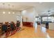 Open concept living and dining area features hardwood floors, modern lighting, and comfortable seating at 18215 N Shadow Ct, Surprise, AZ 85374