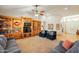 Spacious living room with custom built-in shelving and a cozy seating area for relaxation at 18215 N Shadow Ct, Surprise, AZ 85374