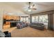 Inviting living room connected to the kitchen and dining area with lots of natural light and comfortable sofas at 18215 N Shadow Ct, Surprise, AZ 85374