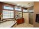 This bathroom features a glass block window, soaking tub, and tiled shower at 18215 N Shadow Ct, Surprise, AZ 85374