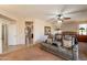 A spacious main bedroom features a comfortable sitting area and a ceiling fan at 18215 N Shadow Ct, Surprise, AZ 85374