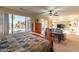 Relaxing primary bedroom with a ceiling fan, sitting area, and sliding door access to the backyard at 18215 N Shadow Ct, Surprise, AZ 85374