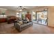 A spacious main bedroom with a seating area and sliding door access to the backyard patio at 18215 N Shadow Ct, Surprise, AZ 85374