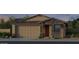 Charming single-story home features a two-car garage and stone accents for added curb appeal at 20221 W Roma Ave, Litchfield Park, AZ 85340