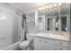 Clean bathroom with a shower-tub, a sink with vanity, and a mirror at 207 W Clarendon Ave # 5H, Phoenix, AZ 85013