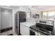 Kitchen featuring stainless steel refrigerator and oven, with white countertops and cabinets at 207 W Clarendon Ave # 5H, Phoenix, AZ 85013
