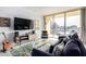 Bright living room with a comfortable sofa and city views at 207 W Clarendon Ave # 5H, Phoenix, AZ 85013