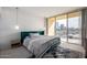 Serene bedroom features a city view, plush bed, and stylish accents at 207 W Clarendon Ave # 5H, Phoenix, AZ 85013
