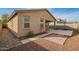 Backyard featuring desert landscaping, patio, and a basketball hoop at 21198 W Berkeley Rd, Buckeye, AZ 85396