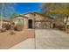 Inviting single-story home featuring a well-kept front yard, a neutral color palette, and a two-car garage at 21198 W Berkeley Rd, Buckeye, AZ 85396