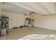 View of the spacious, well-lit garage with epoxy flooring and ample storage space at 21198 W Berkeley Rd, Buckeye, AZ 85396