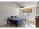 Bedroom with natural light, ceiling fan, and neutral tones create a calming space at 2327 E Pebble Beach Dr, Tempe, AZ 85282