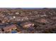Aerial view of houses in a community featuring a house with a pool and desert landscaping at 2330 N Channing --, Mesa, AZ 85207