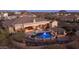 Expansive backyard aerial view with a pool, spa, outdoor seating, and desert landscaping at 2330 N Channing --, Mesa, AZ 85207