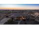 Aerial view of a beautiful house featuring desert landscaping, a tile roof, and outdoor lighting at 2330 N Channing --, Mesa, AZ 85207